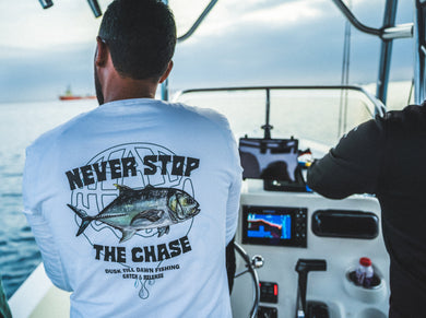 Fishing brand longsleeve white with a giant trevally print and the adventurous text never stop the chase