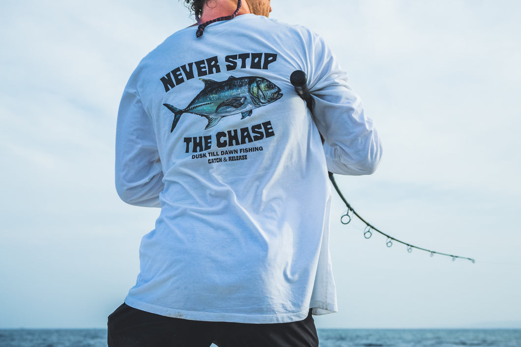 Fishing brand longsleeve white with a giant trevally print and the adventurous text never stop the chase